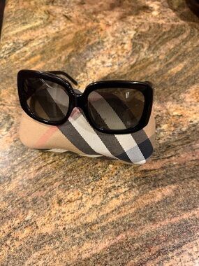 Burberry Black Women's Sunglasses with embossed frames.